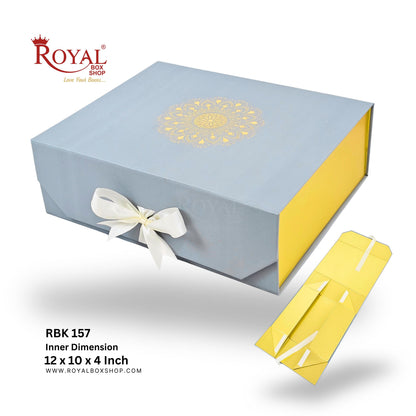 Royal Box Shop gift packaging set featuring a light grey outer box with a gold mandala design and white ribbon, alongside a yellow inner box shown separately on a white background with product text.