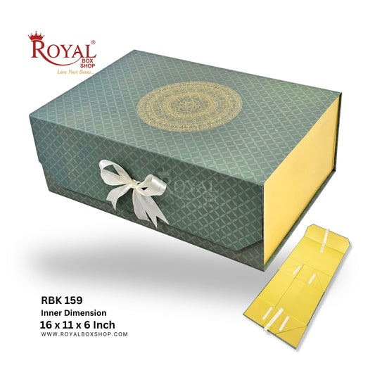 Royal Box Shop presentation packaging box in sage green with a gold mandala design on top, a white ribbon bow, shown alongside its yellow inner box and product text details on a white background.